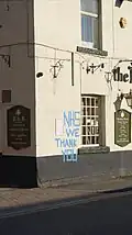 'NHS we thank you' graffiti on a pub in Wetherby, West Yorkshire, made using gaffer tape