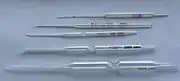 Carlsberg pipettes, glass micropipettes named for their place of invention and first use, The Carlsberg Laboratory, Physiology Department, Copenhagen, Denmark. Used with a mouthpiece for precision biochemical and physiological lab work., From the top: double constriction pipettes for 1 and 10 microlitres; single constriction pipettes for 200; 2,000; and 10,000 microlitres
