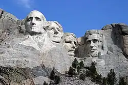 Washington and other figures engraved into the side of a mountain