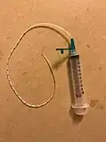 Equipment for supplemental nursing system using syringe, assembled