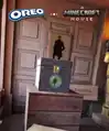 Ender chest on planks block near painting and sign.