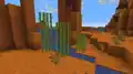 Sugar cane growing on red sand in a badlands biome.