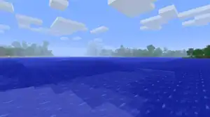 An open Ocean with a couple islands in the distance.