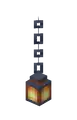 A lantern hanging from an iron chain.