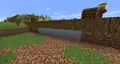 Some clay that naturally spawned in a lake but replaced the dirt under a village farm.