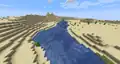 A river running through a desert biome.