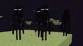 A group of endermen in the End.