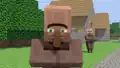 A third villager walking on grass blocks.