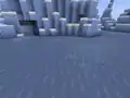 An ocean monument in a deep-frozen ocean, below the ice in Bedrock Edition.
