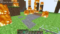 An edited screenshot showing fire enveloping the tree blocks.