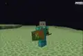 One of the first images of shields. Jeb wearing diamond armor while holding a creeper-emblazoned shield during MineCon 2015.