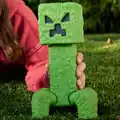 A large, irritated action figure of a creeper