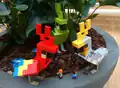 Life sized LEGO parrot models.