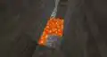 Image by Mojang Studios of a diamond ore concealed behind lava.