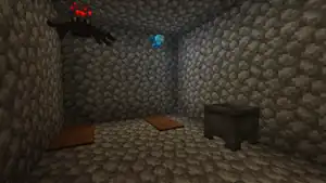 Inside of a jail cell, the only notable features being the carpet "bed" and a cauldron in the corner.