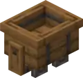 A wooden minecart, featured in the Trails & Tales Event.