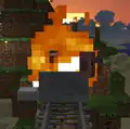 A pig inside a burning minecart.