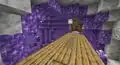 A mineshaft going through an amethyst geode.