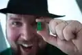 Notch holding a LEGO Micromob creeper.