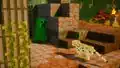 A creeper and an ocelot face each other in a stand-off like moment. Behind them a jungle setting can be seen.