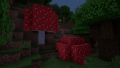 A screenshot of two large red mushroom trees in Minecraft.