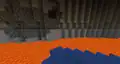 Multiple natural blobs of redstone in to the cave.
