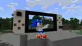 Sonic in front of a build of a Nintendo Switch.