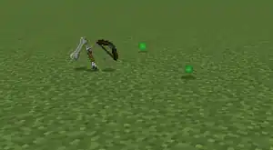 Different sized experience orbs dropped by a skeleton upon death.