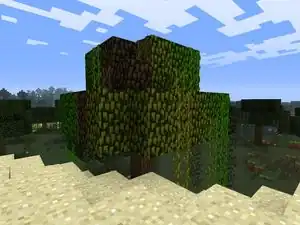 A tree situated on the boundary of a jungle, swamp and desert biome, showing skins of all three on its leaves.