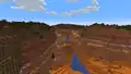 A river forming a canyon inside a wooded badlands biome.