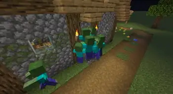 A zombie horde that spawned outside a village hammering at a door during a zombie siege.