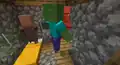 A zombie attacking a villager while the other one is trying to run.