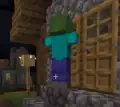 Zombie trying to break through a door of a village house.