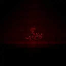 The player is on the mount in a small dark cave, slightly illuminated by the mount's light.