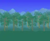 Grove of bushy trees blocking a mountain