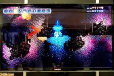 Photo of a TV screen with Terraria: Otherworld being played on it