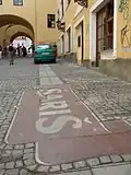 Šariš Brewery logo on the sidewalk in Prešov