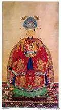 Wife of the 69th generation of Duke Yansheng, wearing mang ao and skirt
