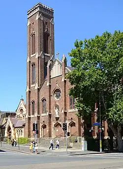 This is a photograph of the Sacred Heart Catholic Church, built in 1850, and the neighbouring Benedict XVI Medical Library