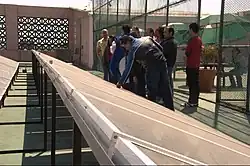 Image 28Participants in a workshop on sustainable development inspect solar panels at Monterrey Institute of Technology and Higher Education, Mexico City on top of a building on campus. (from Solar energy)