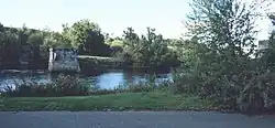 Site of the bridge, with a pier standing alone in the river