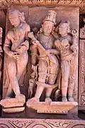 Cross-legged apsara and Vishnu-Lakshmi