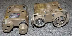 An AN/PEQ-15 and the newer AN/PEQ-16, also made by L3Harris.