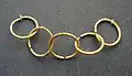 Five interconnecting golden rings