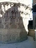 The four bands of muqarnas below the minaret