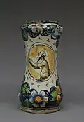 Decorated with Italian motifs including a colorful floral design against a white background and a portrait of a heavenly being also known as a cherub. Manufactured in the second half of the 16th century. Located at the Metropolitan Museum of Art in the European Sculpture and Decorative Arts collection.