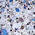 Close-up picture of concrete with blue elements visible