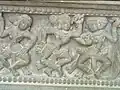A row of apsaras, or celestial nymphs, is depicted on the base of the Trà Kiệu Pedestal.