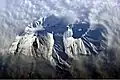 Astronaut photograph highlighting the summit crater and snow-covered slopes of the Avachinsky.