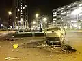 A burned-out car upside down